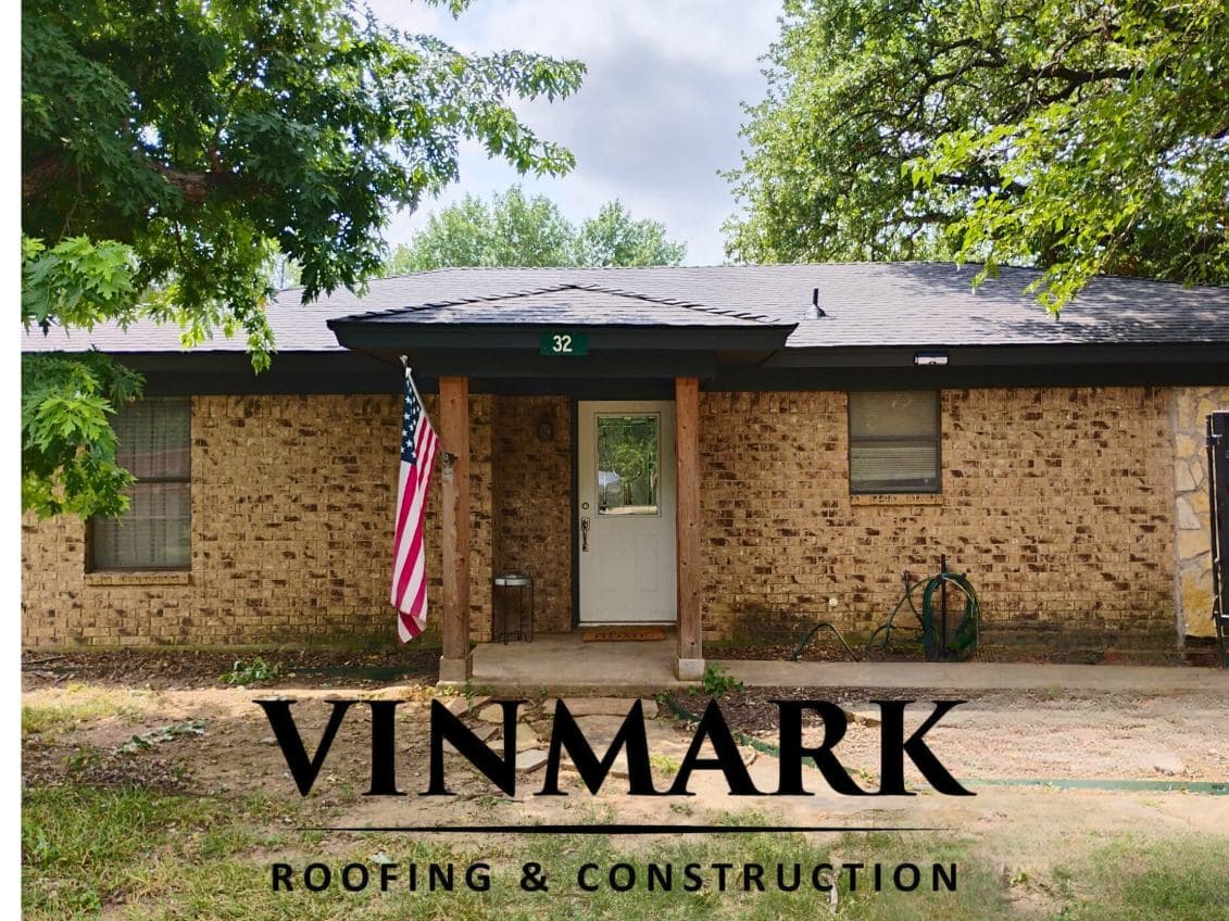 Elegant Black Shingle Roof on Gorgeous Brick Home image